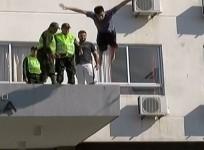 Teenager miraculously survives after headfirst swan dive off building