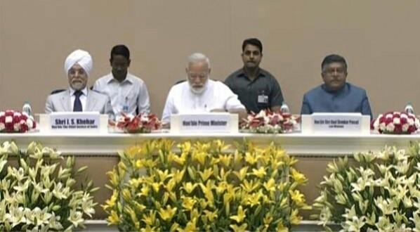 Prime Minister Narendra Modi, flanked by chief Justice of India JS Khehar (left) and Union Law Minister Ravi Shankar Prasad. PM Modi, CJI Khehar and Ravi Shankar Prasad