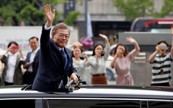 South Korean President Moon Jae-in waves as he heads for the Presidential Blue House in Seoul, South Korea, May 10, 2017. South Korea's President Moon Jae-in, asian stocks rally on south korea presidential elections, indian stock markets, top developments on indian stock markets, asian equities rally