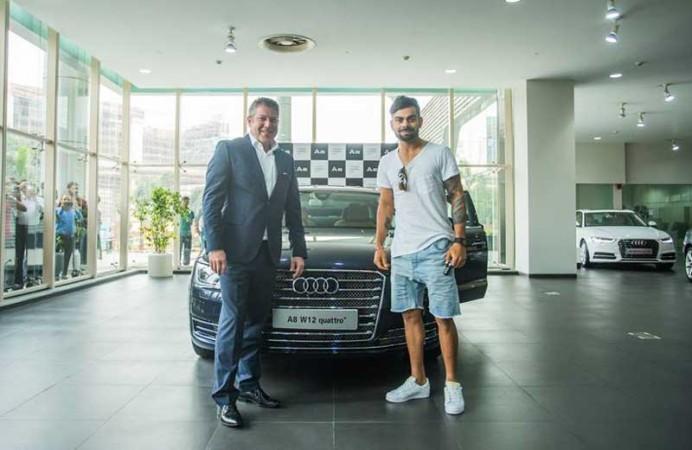 Virat Kohli and his Audi A8 sedan Virat Kohli and Audi