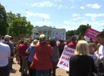 White House protesters demand probe of Comey dismissal
