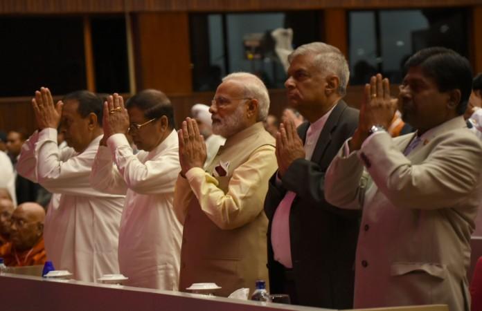 PM Modi along with Sri Lankan President Sirisena and the Prime Minister Wickremesinghe attend the inaugural session of the 14th International Vesak Day celebrations, in Colombo Narendra Modi