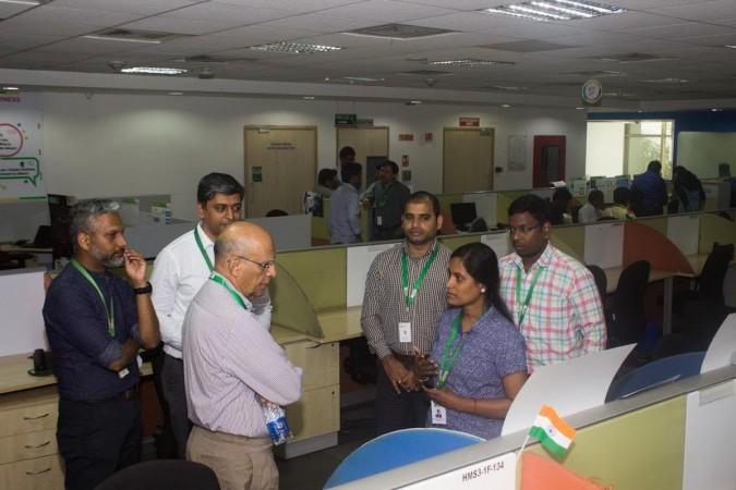 Ashok Soota, third from left, talking to employees at Happiest Minds, Bengaluru ashok soota, happiest minds, happiest minds acquires cupola technology, digital tech, it layoffs
