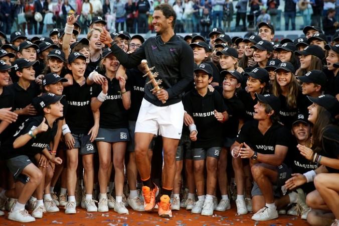 Rafael Nadal with the Madrid Open title. Rafael Nadal, Roger Federer, Madrid Open, French Open