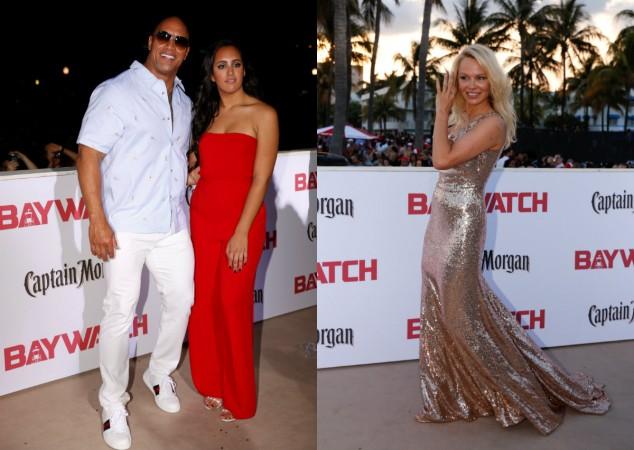 (L to R) Dwayne Johnson with daughter, and Pamela Anderson, who appeared in the original television series, attend the premiere of the film Baywatch in Miami Beach, on May 13, 2017. Baywatch