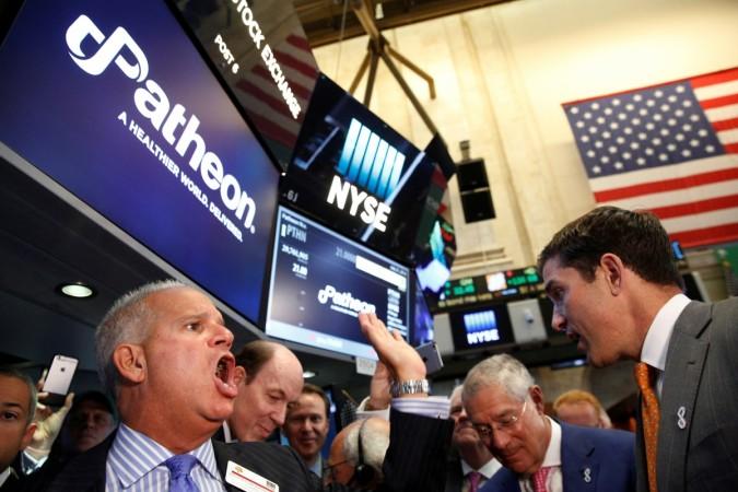 Floor governor Rudy Mass (L) closes the price to begin trading of Patheon NV, during the company's IPO on the floor of the NYSE Patheon NV