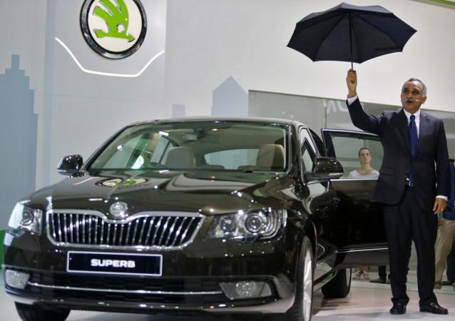 Sudhir Rao, managing director of Skoda Auto India, shows an umbrella that is fitted in the rear door panel in Skoda's newly unveiled Superb. Sudhir Rao, Skoda Auto India, Sudhir Rao Skoda