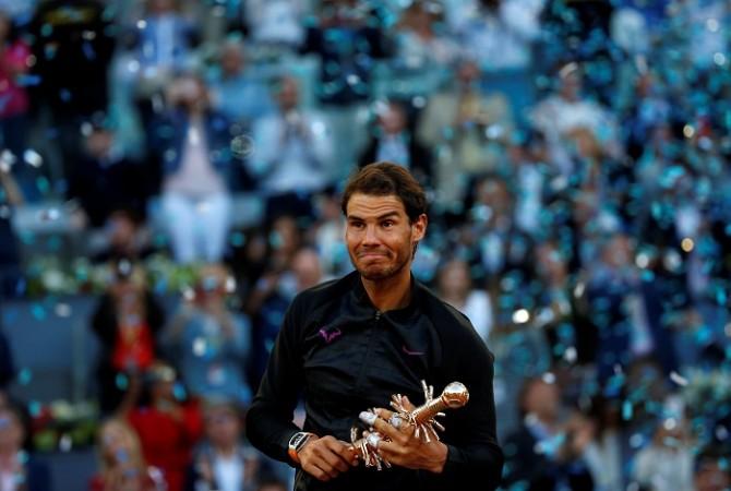 Rafael Nadal with his Madrid Open title. Rafael Nadal, Roger Federer, French Open,