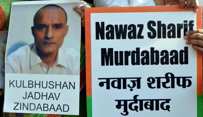 People stage a demonstration after a Pakistani Field General Court Martial awarded the capital punishment to former Indian Navy officer Kulbhushan Jadhav, in Mumbai on April 12, 2017. kulbhushan jadhav, icj, icj verdict on kulbhushan jadhav, naval officer, india, harish salve, pakistan, jadhav arrested, death sentence for kulbhushan jadhav