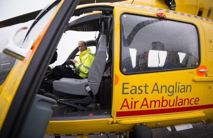 Britain's Prince William sits in the cockpit of his helicopter. Prince William