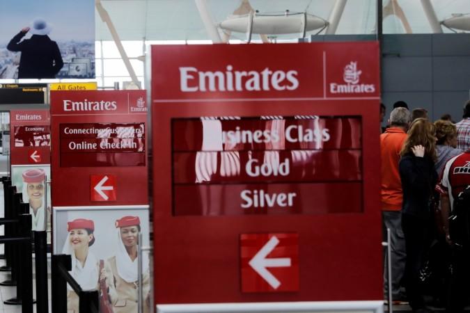 Signs point to the Emirates Airlines check in desks at JFK International Airport in New York, U.S., March 21, 2017. jet airways, jet airways etihad, emirates, emirates 2017 results, etihad emirates merger, gulf carriers hit by us rules, laptops banned to us flights