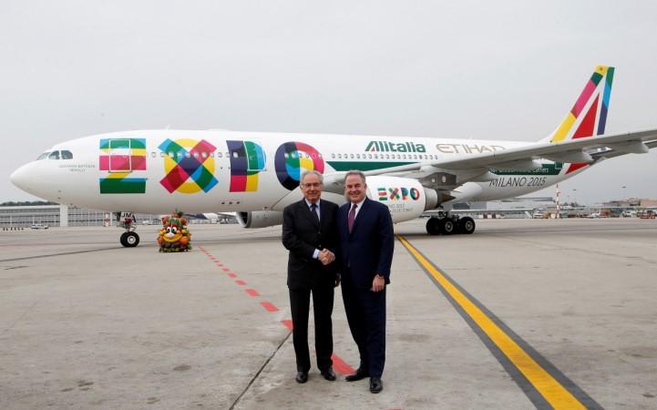 Alitalia President Roberto Colaninno (L) poses with Etihad CEO James Hogan at Malpensa Airport near Milan, Italy October 20, 2014. jet airways, jet airways etihad, emirates, emirates 2017 results, etihad emirates merger, gulf carriers hit by us rules, laptops banned to us flights