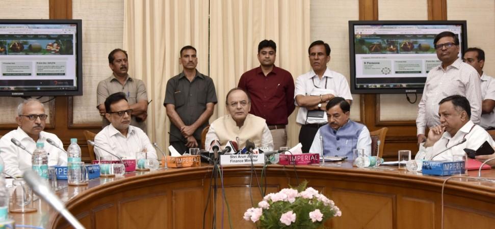 Finance Minister Arun Jaitley addressing at the launch of the new website 'Operation Clean Money', in New Delhi on May 16, 2017. Revenue secretary Hasmukh Adhia and other dignitaries are also seen. income tax, it raids, operation clean money, arun jaitley, it collections, cbi raids, ed raids