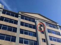 Watch as firefighters stop man from jumping off building