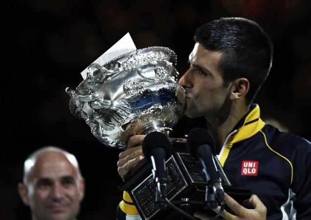 Andre Agassi could provide Novak Djokovic the inspiration he needs to defend his French Open title Andre Agassi, Novak Djokovic, US Open trophy 2013, French Open, coach