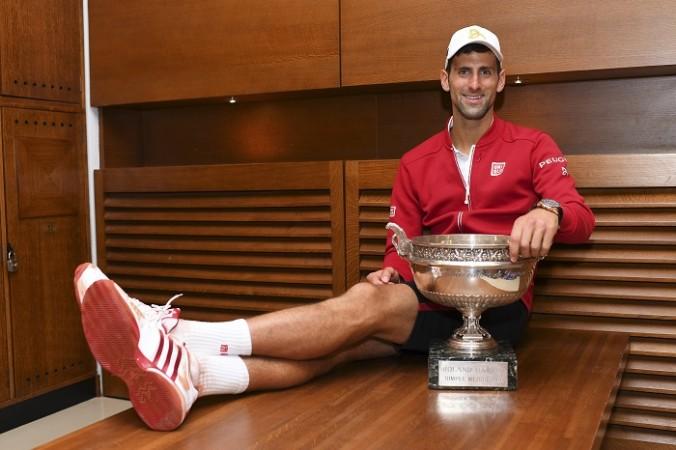 Novak Djokovic with the French Open trophy that he won last year Novak Djokovic, French Open, trophy, Andre Agassi, coach