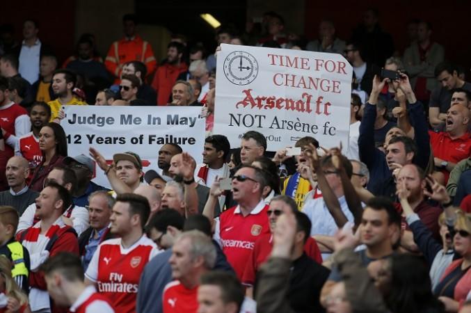 Arsenal fans show their disappointment after another underwhelming season Arsenal, fans, Arsene Wenger, banners, Everton