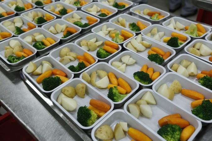 Dishes are prepared inside Cathay Pacific Airway's inflight kitchen near Hong Kong Airport January 14, 2016. cathay pacific, job cuts at cathay pacific, global aviation in turmoil, singapore airlines weak results, radical changes in singapore airlines