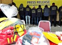 Some of the more than 140 men detained after a raid on what authorities described as a gay prostitution ring being run out of an entertainment venue are shown to the media at a police station in Jakarta, Indonesia May 22, 2017