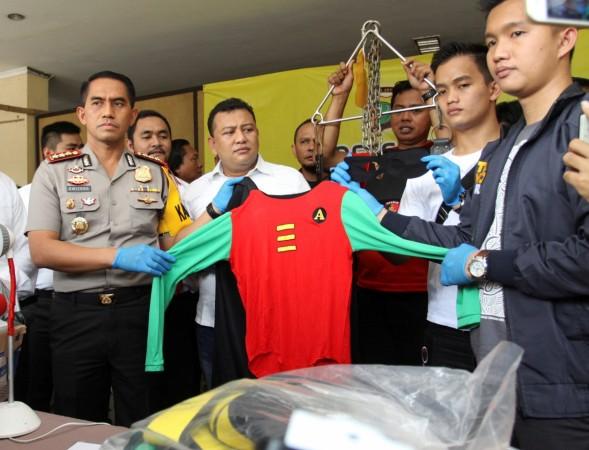 Police show evidence collected following a raid on what authorities described as a gay prostitution ring being run out of an entertainment venue at a police station in Jakarta, Indonesia May 22, 2017 Police show evidence collected following a raid on what authorities described as a gay prostitution ring being run out of an entertainment venue at a police station in Jakarta, Indonesia May 22, 2017