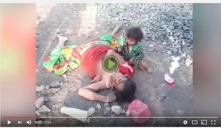 Wailing baby tries to breastfeed as mother lies dead on the railway tracks Toddler cries next to mother's dead body