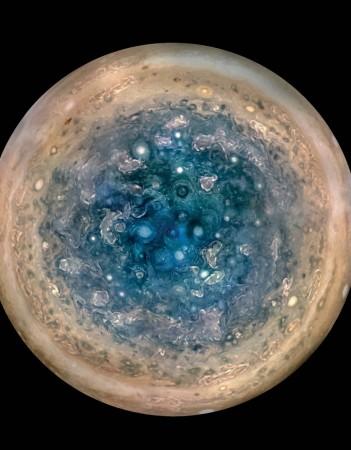 This image shows Jupiter's south pole, as seen by NASA's Juno spacecraft from an altitude of 32,000 miles (52,000 kilometers). The oval features are cyclones, up to 600 miles (1,000 kilometers) in diameter. Multiple images taken with the JunoCam instrument on three separate orbits were combined to show all areas in daylight, enhanced color, and stereographic projection. nasa, Jupiter, south pole, space, explored, Juno spacecraft,