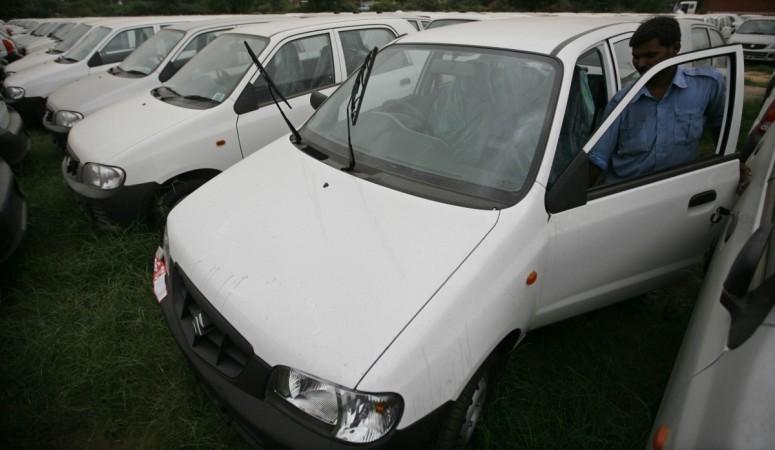 A worker checks the door of a parked Alto car at a Maruti Suzuki stockyard. Top 10 selling cars of April 2017, Best selling cars, India best selling cars