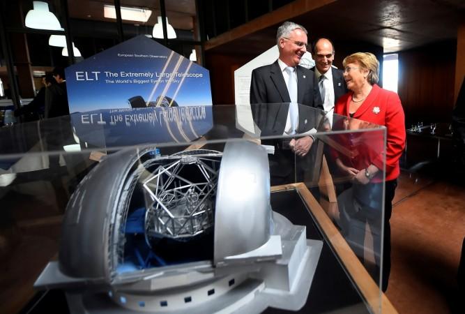 Chile's President Michelle Bachelet and Director General of the European Southern Observatory (ESO) Tim de Zeeuw (L) are seen next to a scale model of the world's largest telescope during a ceremony to inaugurate its construction in the desert of Atacama, Chile, May 26, 2017. world's largest telescope