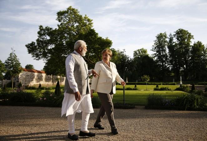Indian Prime Minister Narendra Modi talks to German Chancellor Angela Merkel during their meeting at Meseberg Palace in Meseberg, Germany, May 29, 2017. Modi Merkel