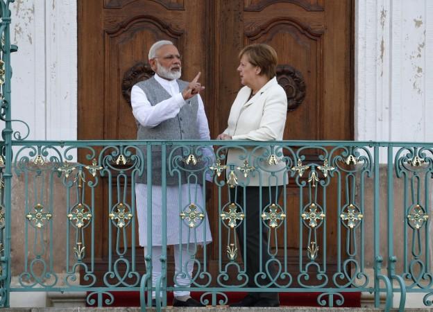 German Chancellor Angela Merkel listens to Indian Prime Minister Narendra Modi during their meeting at the German government guesthouse Meseberg Palace in Meseberg, Germany, May 29, 2017. Modi Merkel