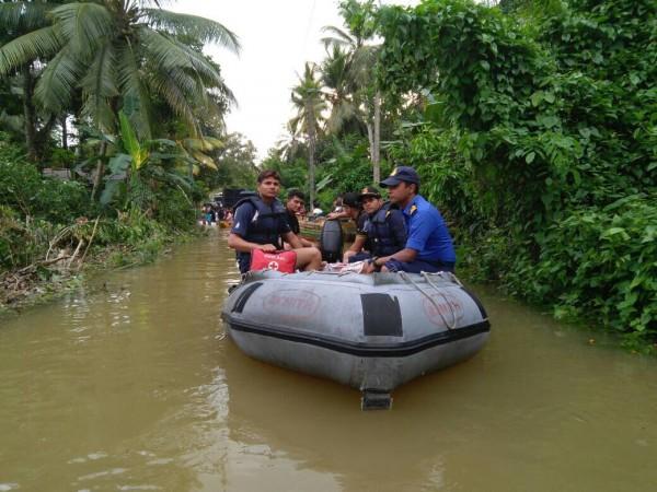In this undated photo, Indian Navy personnel take part in search and rescue operations in Sri Lanka after flooding in May 2017. Indian Navy