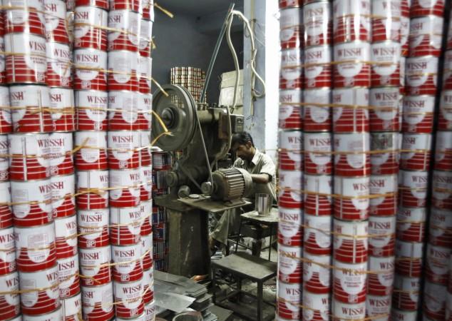A labourer works inside the tin cans manufacturing unit at a factory in New Delhi June 3, 2013. gdp, india gdp, gdp fy18 forecast, smes, small medium enterprises, sme survey, american express survey for sme, india news, gdp forecast, gdp projection