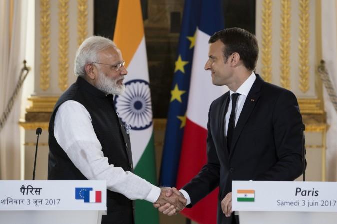 French President Emmanuel Macron (R) and Indian Prime Minister Narendra Modi, shake hands at the end of a joint statement after their meeting at the Elysee Palace in Paris, France, June 3, 2017. Modi Macron