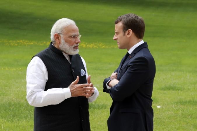 Indian Prime Minister Narendra Modi (L) speaks with French President Emmanuel Macron in the garden of the Elysee Palace following their meeting in Paris, France, June 3, 2017. Modi Macron
