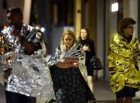 People flee as police attend to an incident near London Bridge