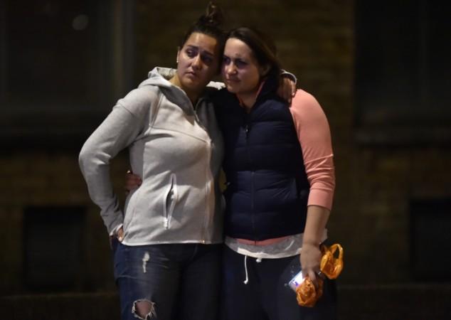 Women embrace after an incident near London Bridge
