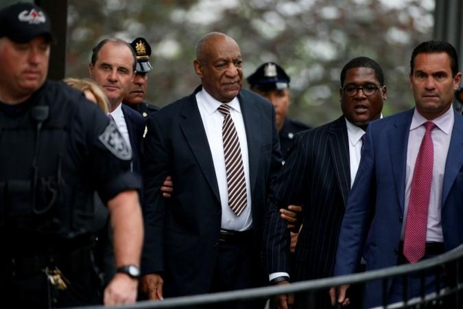 Actor and comedian Bill Cosby (C) leaves with lawyers Fortunato N. Perri, Jr. (R) and Brian McMonagle after the first day of his sexual assault trial at the Montgomery County Courthouse in Norristown, Pennsylvania. Bill Cosby