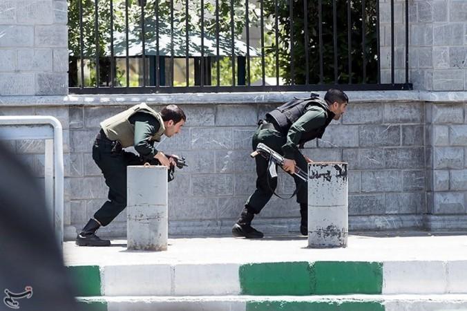 In picture: Members of Iranian forces take cover during an attack on the Iranian parliament in central Tehran, Iran, June 7, 2017. Iran attacks