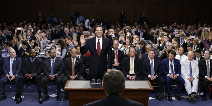 Former FBI Director James Comey is sworn in to testify before a Senate Intelligence Committee hearing on FBI Director James Comey