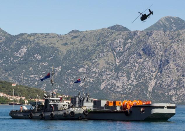 Montenegrin Army helicopter flies over a navy ship during a military exercise in Kotor, Montenegro June 9, 2017. Montenegrin Army helicopter flies over a navy ship during a military exercise in Kotor, Montenegro