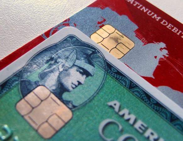 Computer chips are seen on newly-issued credit cards in this photo illustration taken in Encinitas, California September 28, 2015. us economy, america, credit card repayment, credit card debt, new credit card debti, wallet hub report on credit card debt
