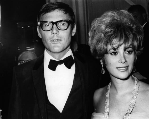 American actor Adam West with the actress Jill St John at the premiere of director John Huston's film, 'The Bible'. Adam West