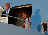 Baron trump emerges from Marine one along with President Donald Trump