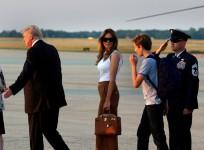 Donald Trump, Melania Trump and Barron Trump arrive at the white house