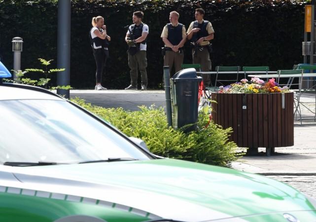 Police officers secure the area around a commuter rail station in Unterfoehring near Munich, southern Germany, where shots were fired on June 13, 2017. Munich Shooting