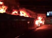 Angry South African commuters torch trains and riot at Cape Town railway station
