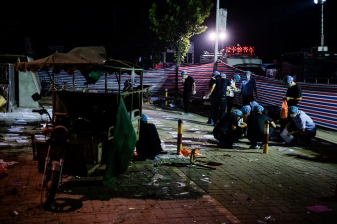Forensic experts work at the site of the explosion near a kindergarten in Xuzhou City, Fengxian County, Jiangsu province, China June 16, 2017. China Kindergarten Blast