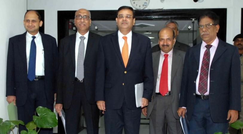 RBI deputy governor Dr Viral V Acharya (extreme left), along with governor Urjit Patel (third from left) during a press conference to announce the second bi-monthly monetary policy review of the fiscal, in Mumbai on June 7, 2017. , rbi, rbi list of 12 defaulters, rbi deputy governor viral acharya, bhushan steel, essar steel, lanco infra, alok industries, NPA ordinance, crackdown on bad loans