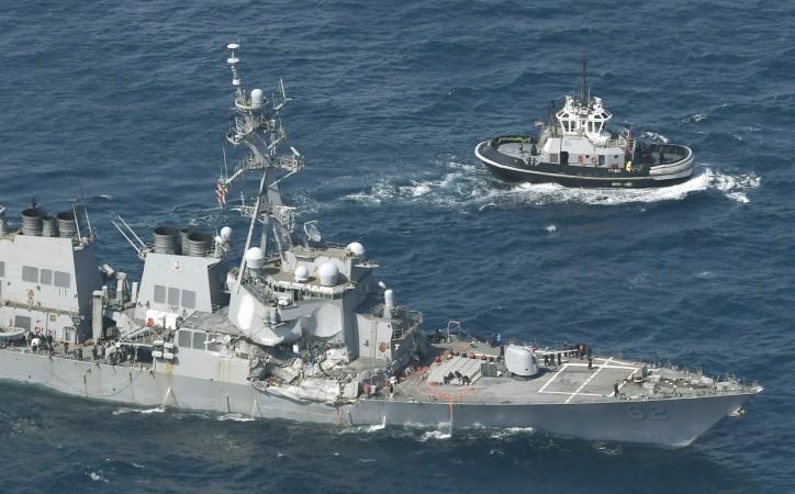 The Arleigh Burke-class guided-missile destroyer USS Fitzgerald, damaged by colliding with a Philippine-flagged merchant vessel, is seen next to a tugboat (R) off Shimoda, Japan, June 17, 2017. The Arleigh Burke-class guided-missile destroyer USS Fitzgerald, damaged by colliding with a Philippine-flagged merchant vessel, is seen next to a tugboat (R) off Shimoda, Japan in this photo taken by Kyodo June 17, 2017