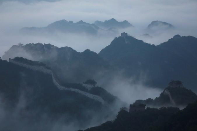 Early morning fog covers the Jiankou section of the Great Wall, located in Huairou District, north of Beijing, China. At one of the most treacherous and least restored stretches of China's Great Wall, a line of pack mules halted upon emerging from the gloom of a dense forest draped in mist and dew. Early morning fog covers the Jiankou section of the Great Wall, located in Huairou District, north of Beijing, China. At one of the most treacherous and least restored stretches of China's Great Wall, a line of pack mules halted upon emerging from the glo